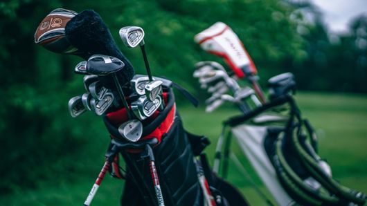 golf club and bags on a golf course